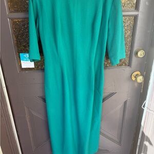 1960s teal wool mid sleeve dress has one hole